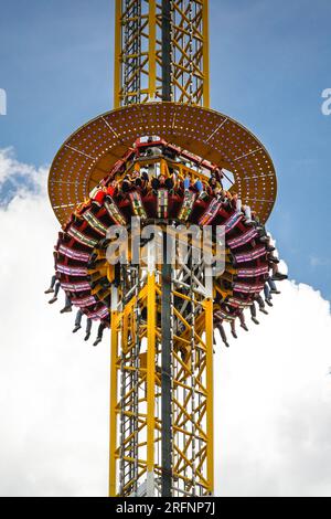 Herne, Germany. 04th August, 2023 People on the 85 metre high 'Hangover - The Tower' ride. Cranger Kirmes funfair is one of the largest in Germany. The popular fair regularly attracts more than 4m visitors during its 10 day run. The fair dates back to the early 18th century at Crange. Credit: Imageplotter/Alamy Live News Stock Photo