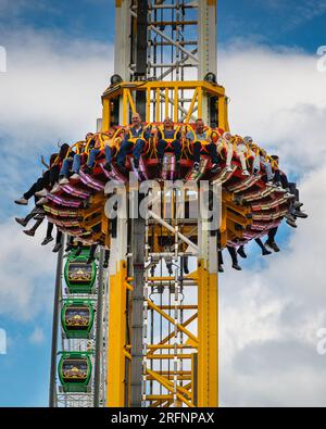 Herne, Germany. 04th August, 2023 People on the 85 metre high 'Hangover - The Tower' ride. Cranger Kirmes funfair is one of the largest in Germany. The popular fair regularly attracts more than 4m visitors during its 10 day run. The fair dates back to the early 18th century at Crange. Credit: Imageplotter/Alamy Live News Stock Photo