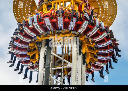 Herne, Germany. 04th August, 2023 People on the 85 metre high 'Hangover - The Tower' ride. Cranger Kirmes funfair is one of the largest in Germany. The popular fair regularly attracts more than 4m visitors during its 10 day run. The fair dates back to the early 18th century at Crange. Credit: Imageplotter/Alamy Live News Stock Photo