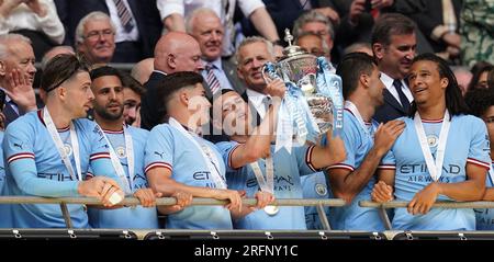 Manchester City's Phil Foden lifts the FA Cup trophy as he celebrates winning the Emirates FA Cup final at Wembley Stadium, London. Picture date: Saturday June 3, 2023. See PA Story SOCCER Final. Photo credit should read: Nick Potts/PA Wire. RESTRICTIONS: EDITORIAL USE ONLY No use with unauthorised audio, video, data, fixture lists, club/league logos or 'live' services. Online in-match use limited to 120 images, no video emulation. No use in betting, games or single club/league/player publications. Stock Photo