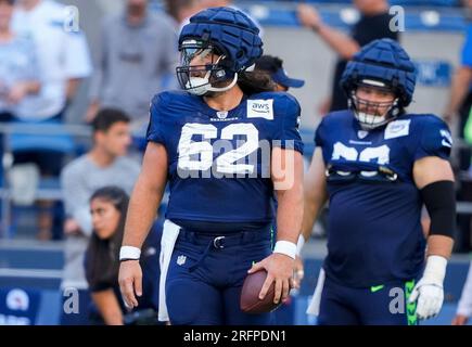 Seattle Seahawks center Joey Hunt (62) and offensive tackle Jalen McKenzie  (76) run a drill during the NFL football team's training camp, Wednesday,  Aug. 9, 2023, in Renton, Wash. (AP Photo/Lindsey Wasson