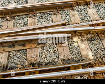 railway switch of narrow gauge railway tracks. detailed closeup view. Stock Photo