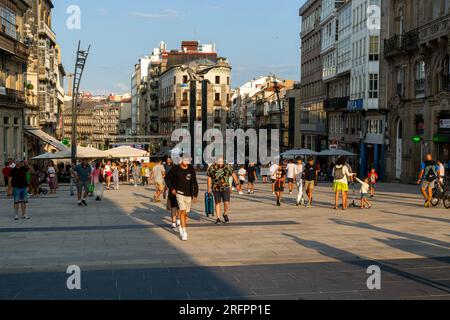 People in pedestrianised central square, Praza Porto do Sol plaza, city centre of Vigo, Galicia, Spain Stock Photo