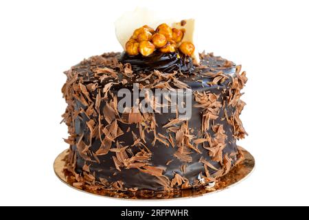 Celebration cake. Birthday cake with crocus isolated on white background. Chocolate covered cake. close up Stock Photo