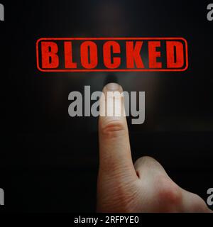 index finger pointing at a locked digital screen Stock Photo