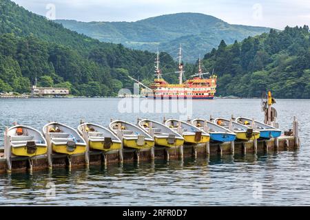 Pleasure boats on Lake Ashi, also know as Hakone Ashinoko Lake, a crater lake in an extinct volcano in Hakone, Japan. Stock Photo
