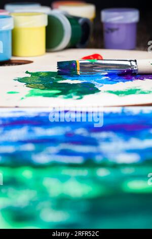 high-quality paints and tools for painting pictures, paints and art brushes for drawing, multi-colored paints close-up Stock Photo