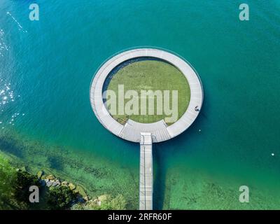 Aerial image of the public swimming pool at the Zurich lake side with a wooden circle toddler pond Stock Photo