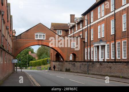 Marlborough College buildings and arch across road, pubic school in the Wiltshire town, England, UK Stock Photo