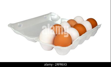 Open egg box with ten white and brown eggs isolated from background. Fresh organic chicken eggs in styrofoam pack or egg container Stock Photo