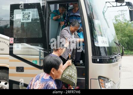 Beijing, China. 05th Aug, 2023. (230805) -- BEIJING, Aug. 5, 2023 (Xinhua) -- Villagers who have been evacuated to a settlement site return to Koutou Village of Qinglonghu Town in Fangshan District of Beijing, capital of China, Aug. 5, 2023. As this round of typhoon-induced torrential rains have come to an end in Beijing, some villagers of Fangshan District, who had been evacuated to settlement sites due to heavy rainfall over the previous few days, returned home on Saturday after experts assessed the safety of their residences.   Beijing has, over the past few days, seen the heaviest rainfall Stock Photo