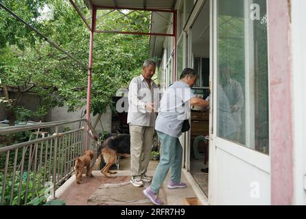 Beijing, China. 05th Aug, 2023. (230805) -- BEIJING, Aug. 5, 2023 (Xinhua) -- Villagers who have been evacuated to a settlement site return to their home in Koutou Village of Qinglonghu Town in Fangshan District of Beijing, capital of China, Aug. 5, 2023. As this round of typhoon-induced torrential rains have come to an end in Beijing, some villagers of Fangshan District, who had been evacuated to settlement sites due to heavy rainfall over the previous few days, returned home on Saturday after experts assessed the safety of their residences.   Beijing has, over the past few days, seen the hea Stock Photo