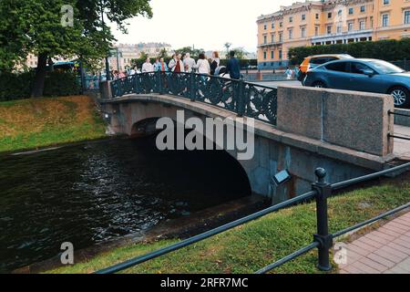 Saint Petersburg, Russia - July 29, 2023: Ancient stone bridge across the river in St. Petersburg Stock Photo