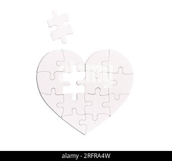 Heart shaped puzzle with missing lacking piece isolated on white background. Love problems concept. Stock Photo