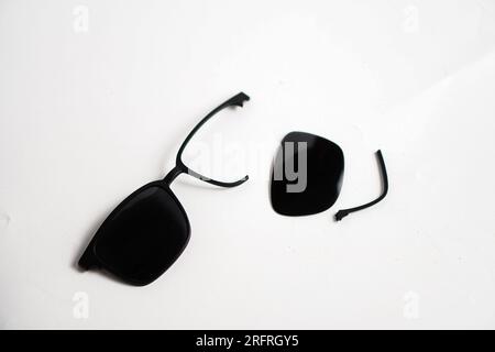 broke black sunglasses on white background Stock Photo