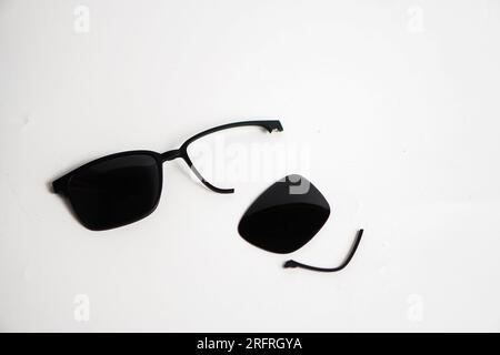 broke black sunglasses on white background Stock Photo