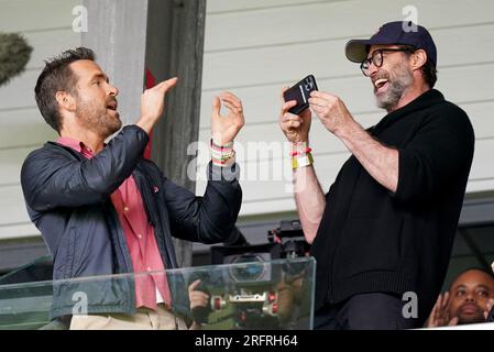 Wrexham Co-Owner, Ryan Reynolds (left) and Hugh Jackman in the stands before the Sky Bet League Two match at the SToK Racecourse, Wrexham. Picture date: Saturday August 5, 2023. Stock Photo