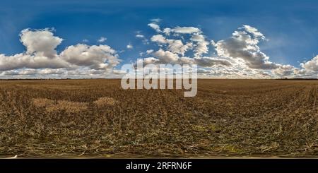 360 degree panoramic view of spherical 360 hdri panorama among farming field with clouds on blue sky in equirectangular seamless projection, use as sky replacement in drone panora