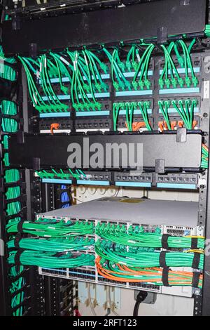 Photo of IT equipment and patch cables in a surver room Stock Photo