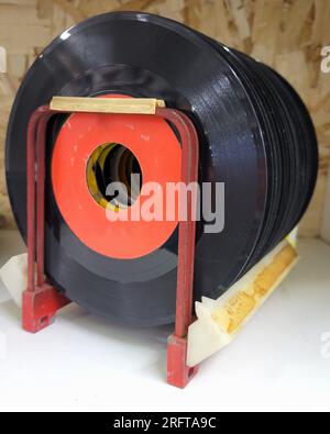 45 Rpm Racks A collection of vintage 45 RPM (45's) records, displayed in a metal ...
