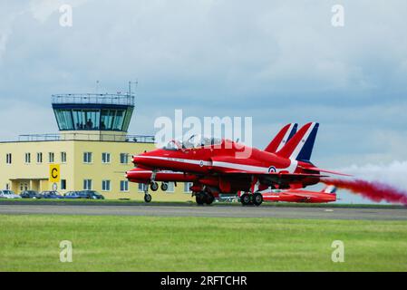 RAF Red Arrows BAe Hawk jet planes taking off at Cotswold Airport, formerly RAF Kemble, Gloucestershire, UK, where the team were based. Folland Gnat Stock Photo