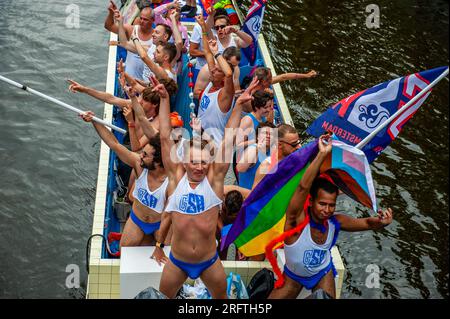 Amsterdam, Netherlands. 05th Aug, 2023. Gay gymnasts are seen dancing on a small boat during the event. The Canal Parade starts around noon and takes all afternoon. Around 80 boats of different organisations and non-profit organisations participate in the event. The Canal Parade is what Amsterdam Gay Pride is famous for. It's the crown of their two weeks lasting festival that features more than 200 events. The boats start at the Scheepvaart museum in the eastern part of the city center moving towards the Amstel River. Credit: SOPA Images Limited/Alamy Live News Stock Photo