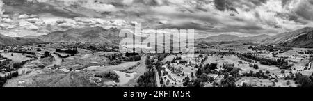 Dramatic arrowtown town in scenic vale of New Zealand South Island at Lake Hayes near QUeenstown- aerial panorama. Stock Photo