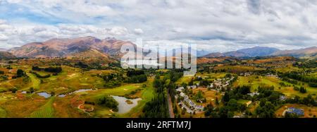 HIstoric arrowtown town in scenic vale of New Zealand South Island at Lake Hayes near QUeenstown- short aerial panorama. Stock Photo