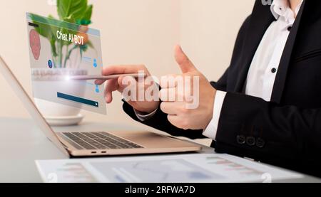 Businessman using a laptop computer chatting Stock Photo