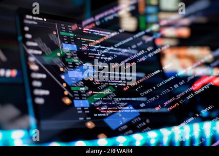 Notebook closeup photo. CSS, JavaScript and HTML usage. Monitor closeup of function source code. Abstract IT technology background. Stock Photo