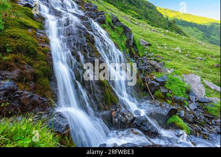 Waterfall in Fagaras Mountains, Romania. Stock Photo