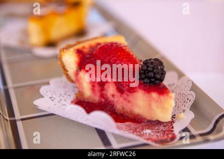 Slice of Mixed berries cheesecake served Stock Photo