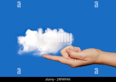 woman finger holding a white cloud, cloud computing concept Stock Photo