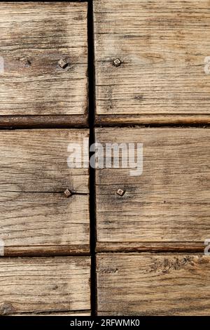 close up aged wooden boards nailed with blacksmith's nails in the Madonie Regional Natural Park, Sicily, Italy Stock Photo