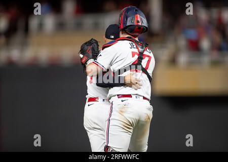 Minnesota Twins relief pitcher Jovani Moran (71) celebrates a team victory with catcher Ryan Jeffers (27) during a MLB regular season game between the Stock Photo