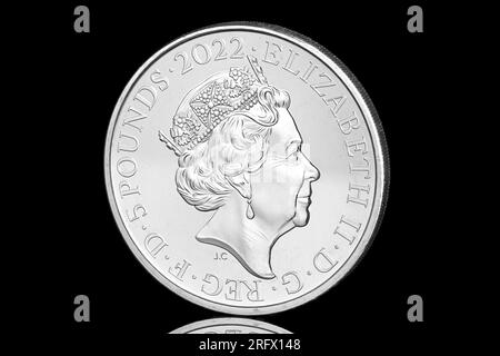 2022 £5 coin featuring the 5th coin portrait of Queen Elizabeth II by Jody Clark.  This coin commemorates the 60th anniversary of The Rolling Stones Stock Photo