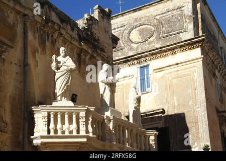 Lecce, Italy. The Propylaea entering Piazza del Duomo, with three statues of saints. Stock Photo