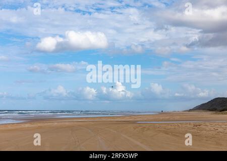 Fraser Island K'gari 75 mile beach and small light aircraft flies over the sand road and ocean tourist trips,Queensland,Australia Stock Photo