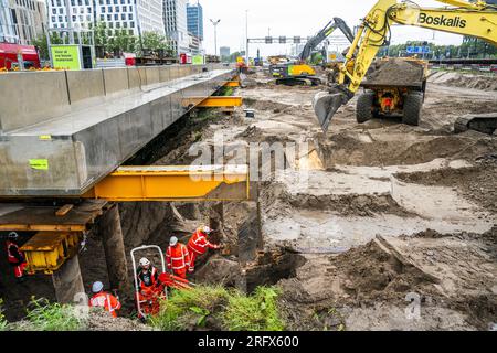 AMSTERDAM - Work on the A10 motorway. The A10 and A4 motorways and a section of train track have been temporarily closed in order to install two huge roof sections at Amsterdam Zuid station. ANP JEROEN JUMELET netherlands out - belgium out Stock Photo