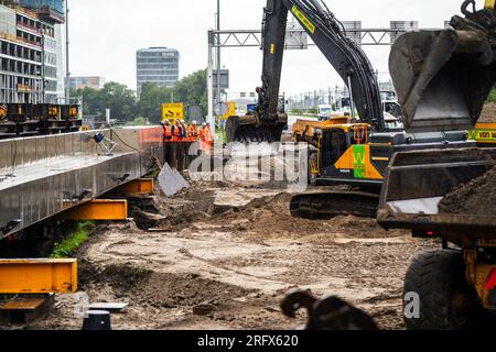 AMSTERDAM - Work on the A10 motorway. The A10 and A4 motorways and a section of train track have been temporarily closed in order to install two huge roof sections at Amsterdam Zuid station. ANP JEROEN JUMELET netherlands out - belgium out Stock Photo