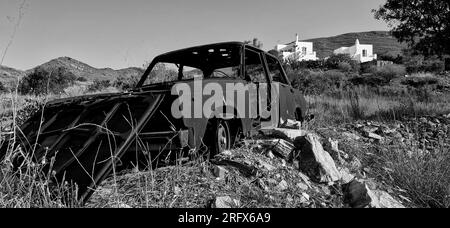 Burned car wreck, land fire aftermath, Greece, Southern Europe Stock Photo