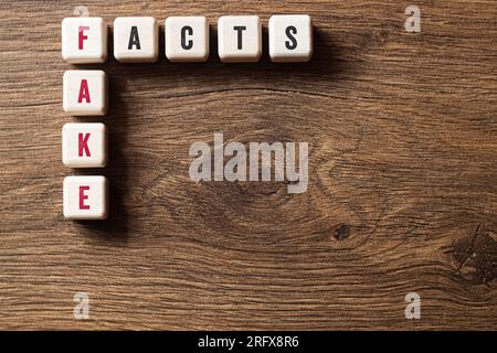 Fake facts - word concept on building blocks, text, letters Stock Photo