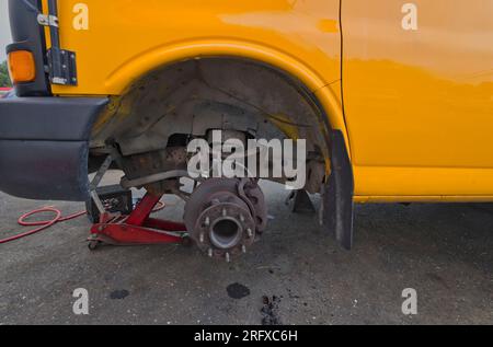 School bus brakes being repaired Stock Photo