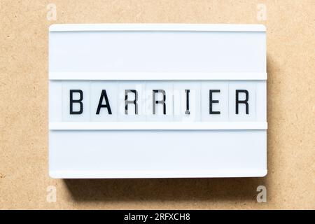 Lightbox with word barrier on wood background Stock Photo