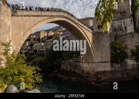 Mostar, Bosnia and Herzegovina, Traditional jump from Old Mostar Bridge, originally built in 1557, destroyed during the war in 1993.Rebuilt in 2003 Stock Photo