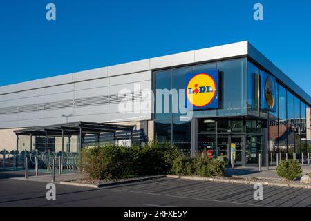 Exterior view of a Lidl supermarket. Lidl is a German international discount retailer chain known for its low prices Stock Photo