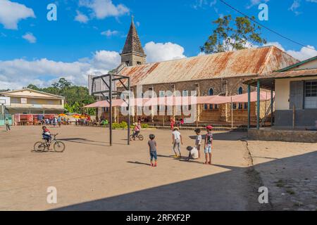 Andasibe, Madagascar - May 26.2023: The church at the village Andasibe with playing children Stock Photo