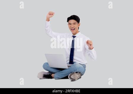 Portrait young asian business man sitting work on laptop computer to internet online isolated white background, businessman confident and notebook, fr Stock Photo