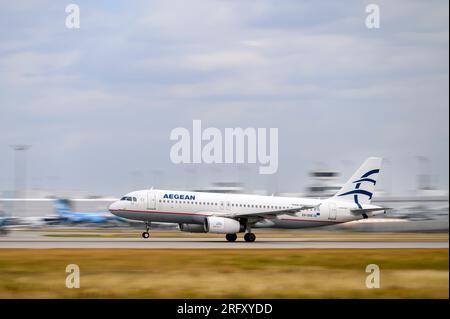 Munich, Germany - July 03. 2023 : Aegean Airlines Airbus A320-232 with the aircraft registration SX-DGE is starting on the southern runway 26L of the Stock Photo