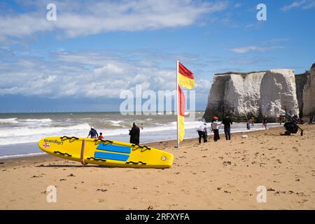 Kent UK. 06th August 2023. UK Weather. Strong  winds can be felt and choppy sea water seen at Kent south coast while Storm Antoni hits England' south west coast with near-80mph gusts. People still enjoying sunny day on beach swimming in incoming waves. Credit: xiu bao/Alamy Live News Stock Photo